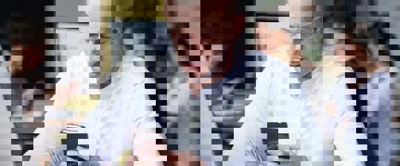 picture of man at desk on phone